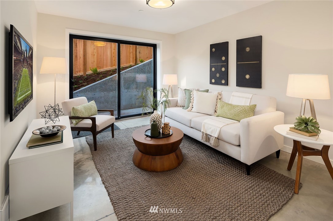 330 3rd Avenue South, Unit B Kirkland, WA 98033 - Photo 22 of 36 a living room with furniture and a flat screen tv