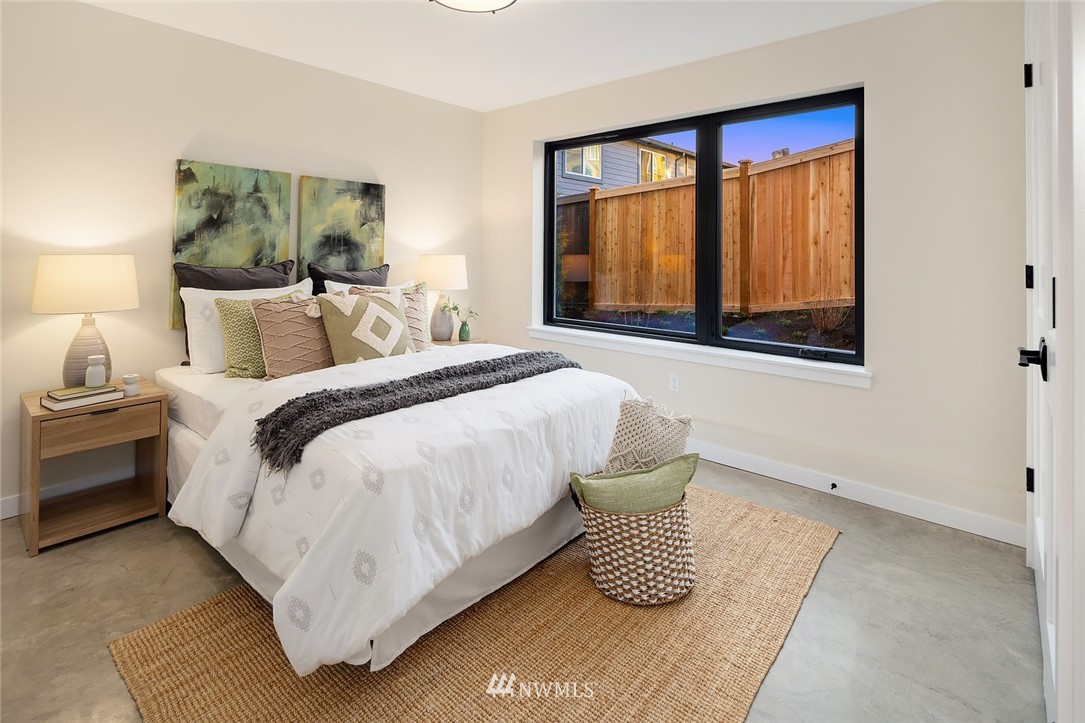 330 3rd Avenue South, Unit B Kirkland, WA 98033 - Photo 23 of 36 a bedroom with a bed and a large window