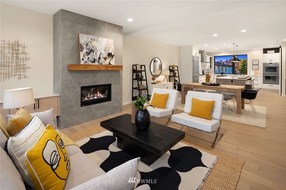 330 3rd Avenue South, Unit B Kirkland, WA 98033 - Photo 4 of 36 a living room with furniture and a fireplace