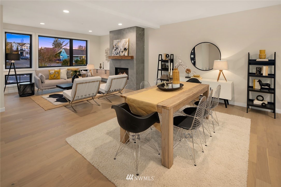 330 3rd Avenue South, Unit B Kirkland, WA 98033 - Photo 5 of 36 a living room with furniture a flat screen tv and kitchen view