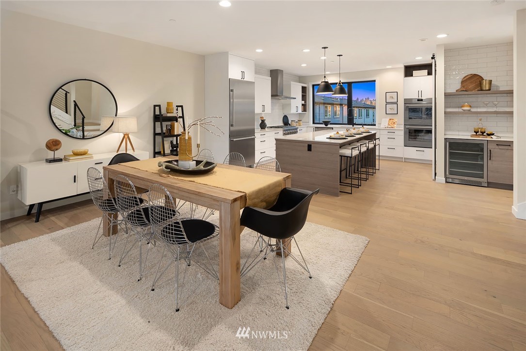330 3rd Avenue South, Unit B Kirkland, WA 98033 - Photo 6 of 36 a living room with stainless steel appliances furniture a dining table and kitchen view