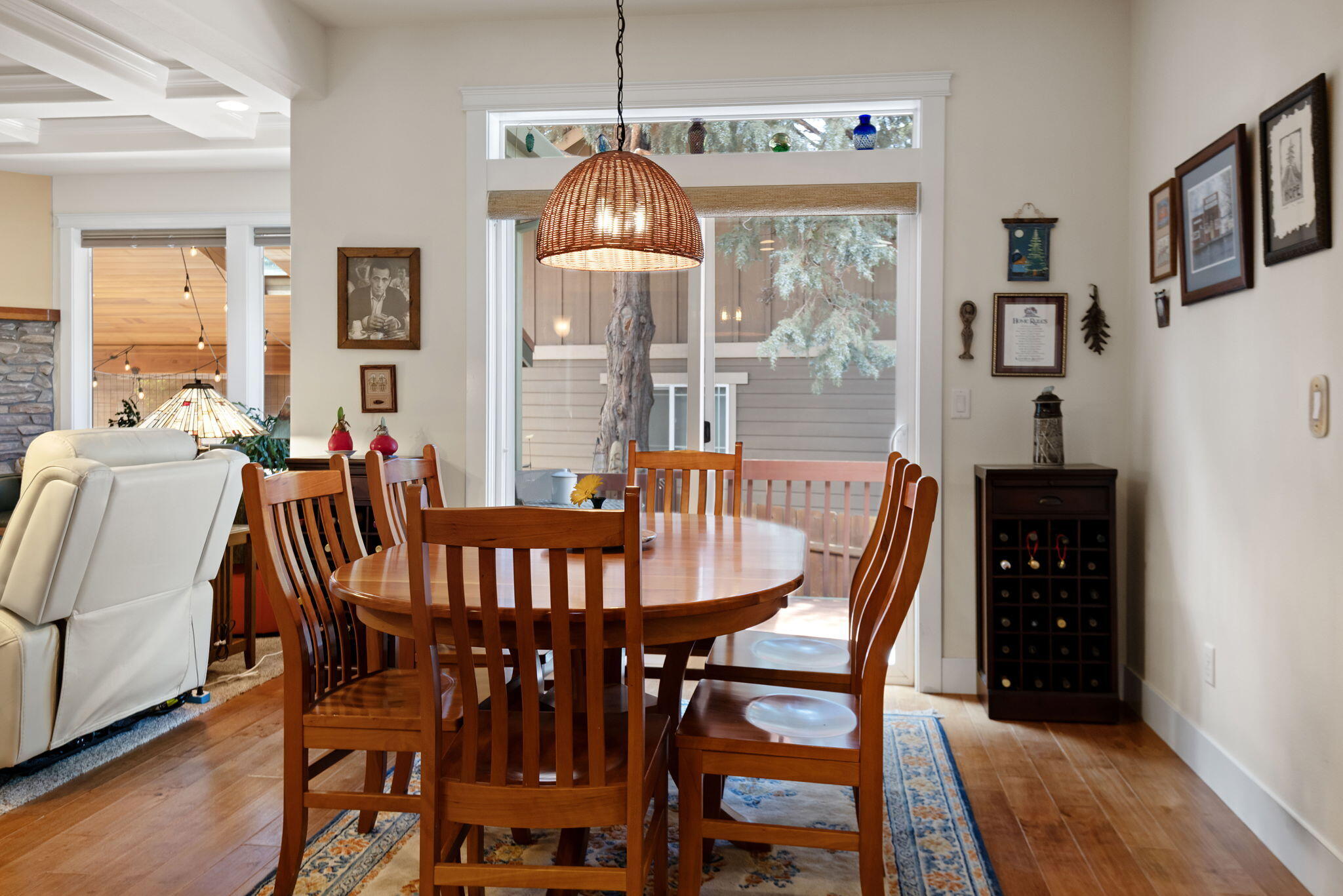 62944 Fresca Street Bend, OR 97703 - Photo 7 of 32 a view of a dining room with furniture window and wooden floor