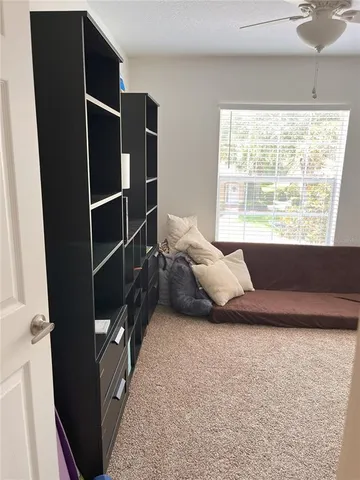 a bed room with a bed and a window