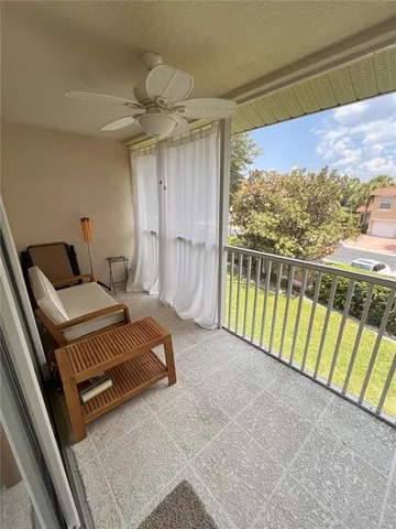 a view of a living room and a balcony