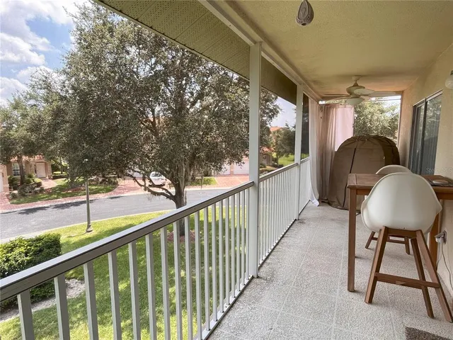a view of a balcony and furniture