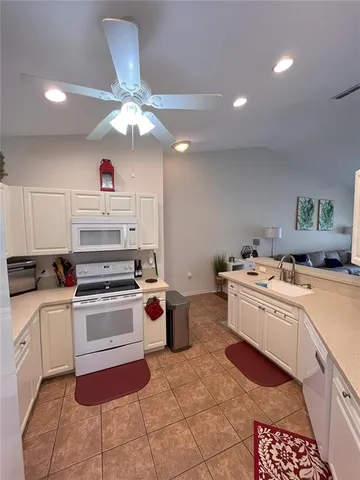 a kitchen with a stove cabinets and counter space