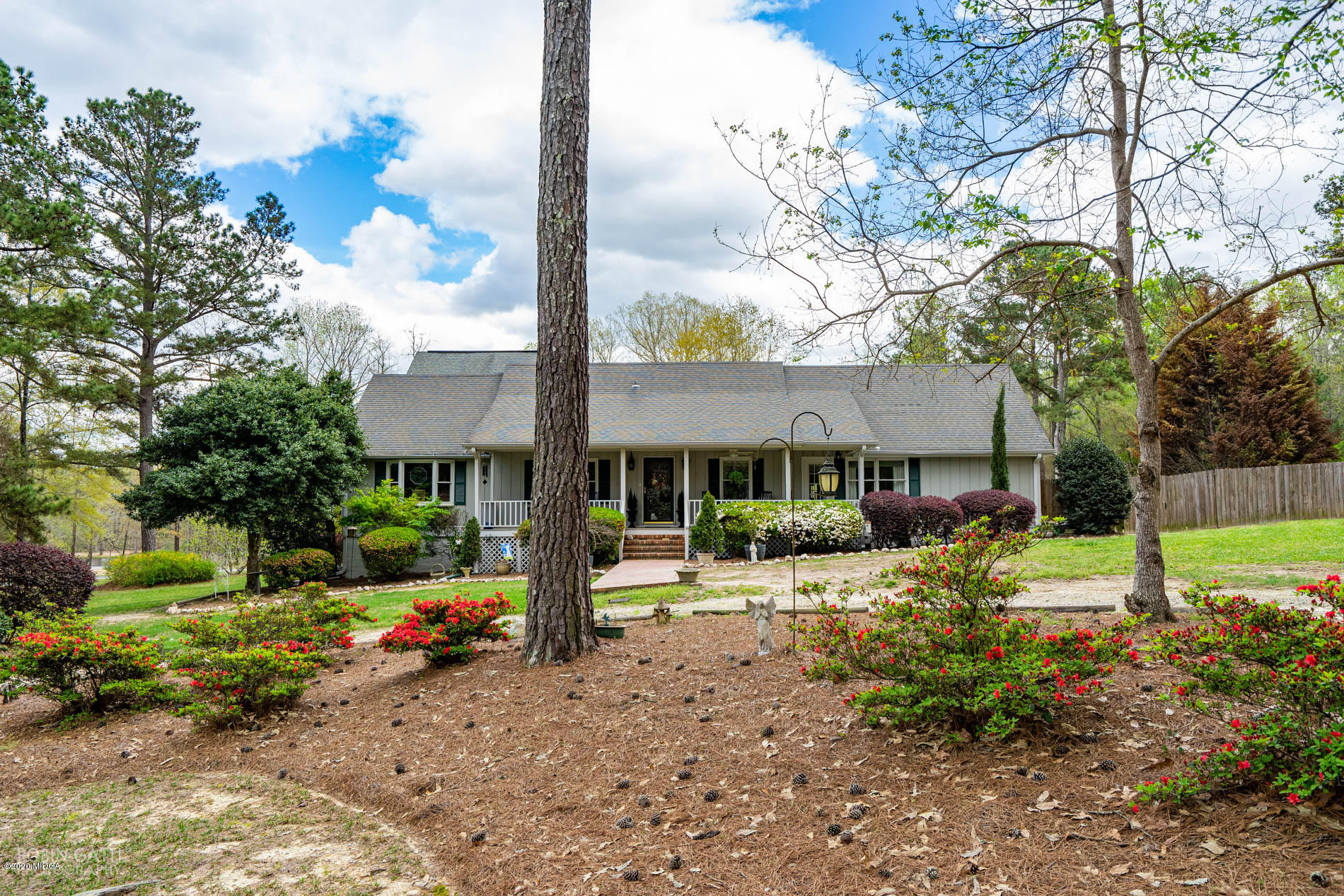 a house view with a sitting space and garden