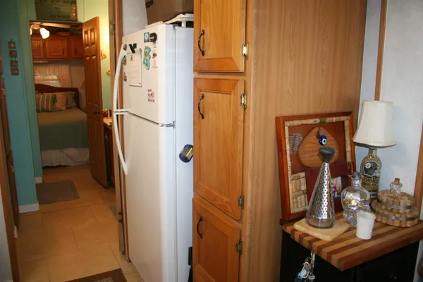 a bed room with a bed and a chair