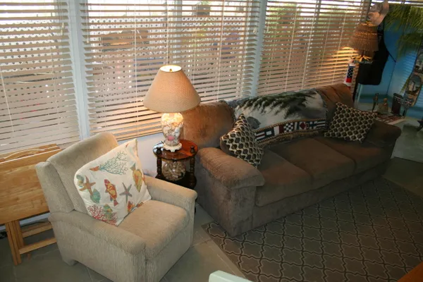 a walk in closet with wooden cabinets