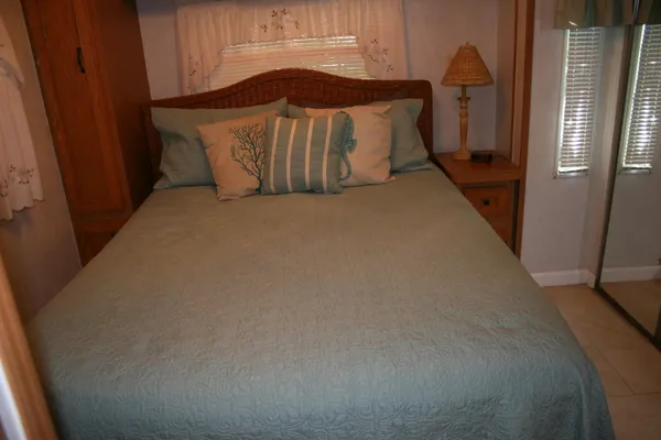 a white toilet sitting next to a small bathroom