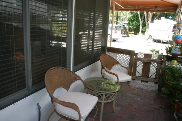a outdoor dining space with furniture