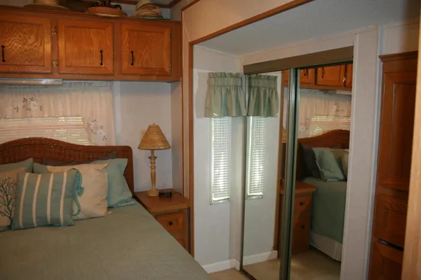 a bathroom with a sink a mirror and a shower curtain