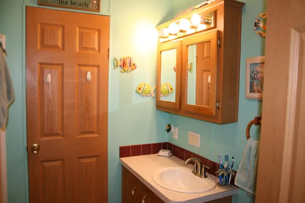 a view of a house with backyard sitting area and garden