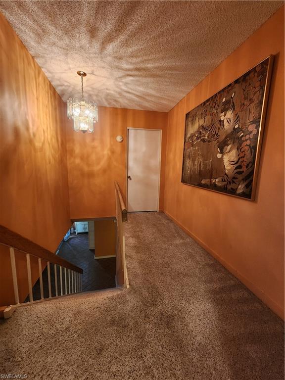 925 Palm View Drive, Unit F120 Naples, FL 34110 - Photo 12 of 25 a view of hallway with stairs