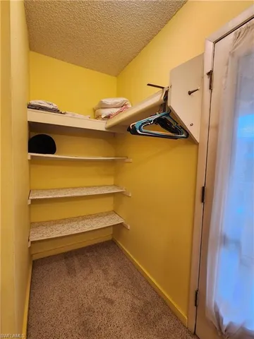 a view of storage and utility room with a sink