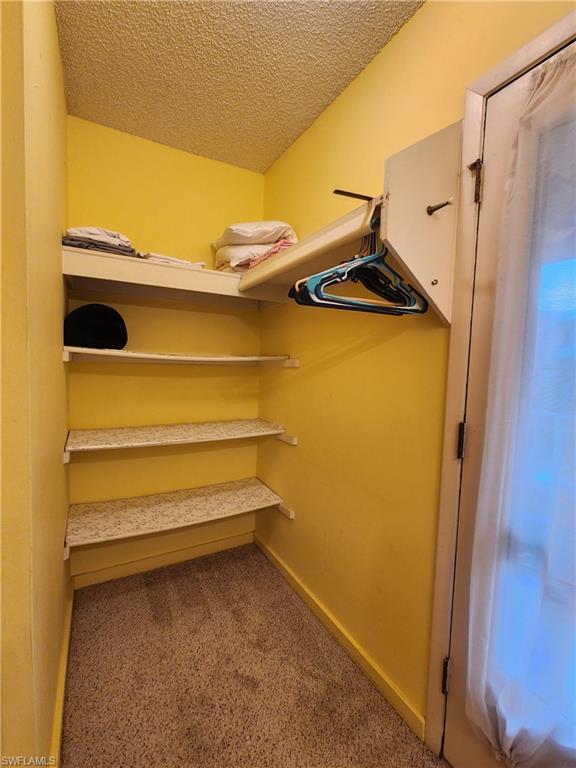 925 Palm View Drive, Unit F120 Naples, FL 34110 - Photo 15 of 25 a view of storage and utility room with a sink