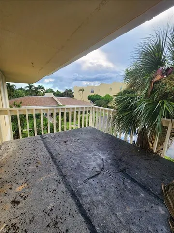 a view of a garden with an ocean view