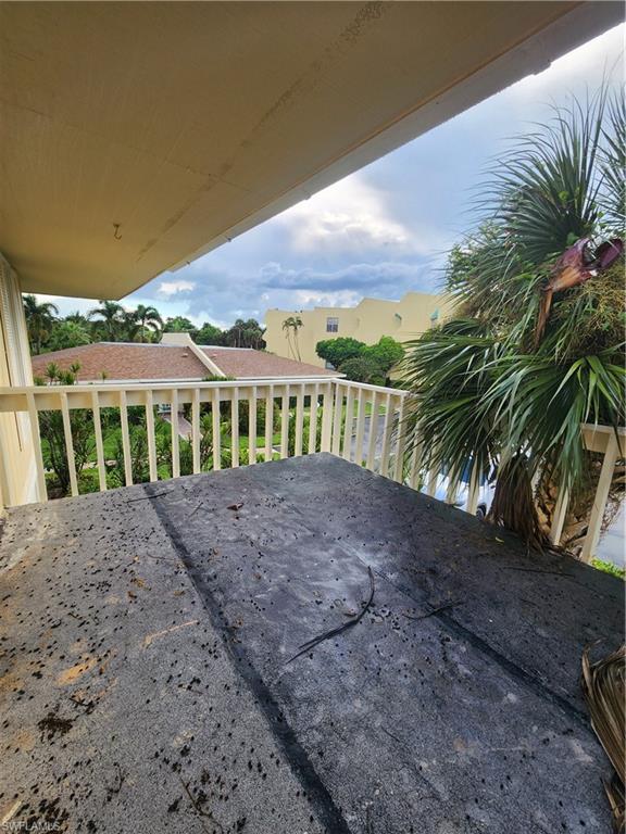 925 Palm View Drive, Unit F120 Naples, FL 34110 - Photo 16 of 25 a view of a garden with an ocean view