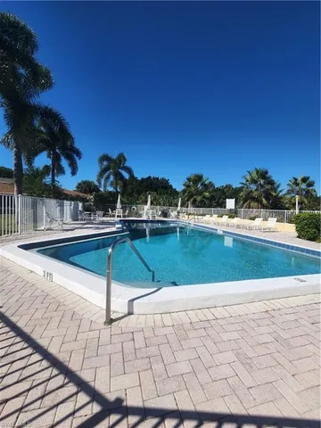 a view of swimming pool with a yard