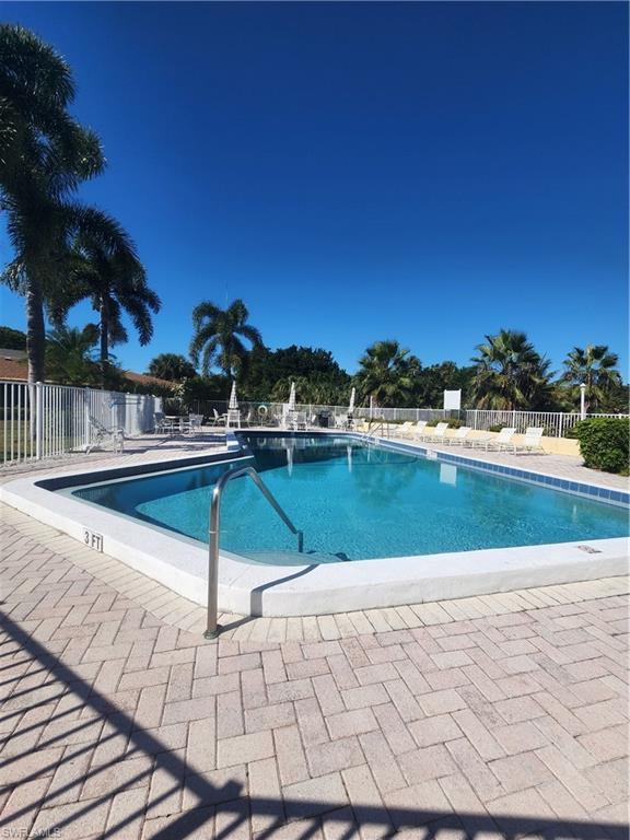 925 Palm View Drive, Unit F120 Naples, FL 34110 - Photo 25 of 25 a view of swimming pool with a yard