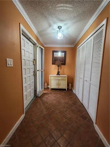 a view of a hallway with front door