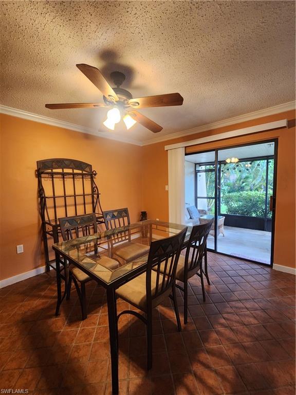 925 Palm View Drive, Unit F120 Naples, FL 34110 - Photo 9 of 25 a dining room with furniture and window