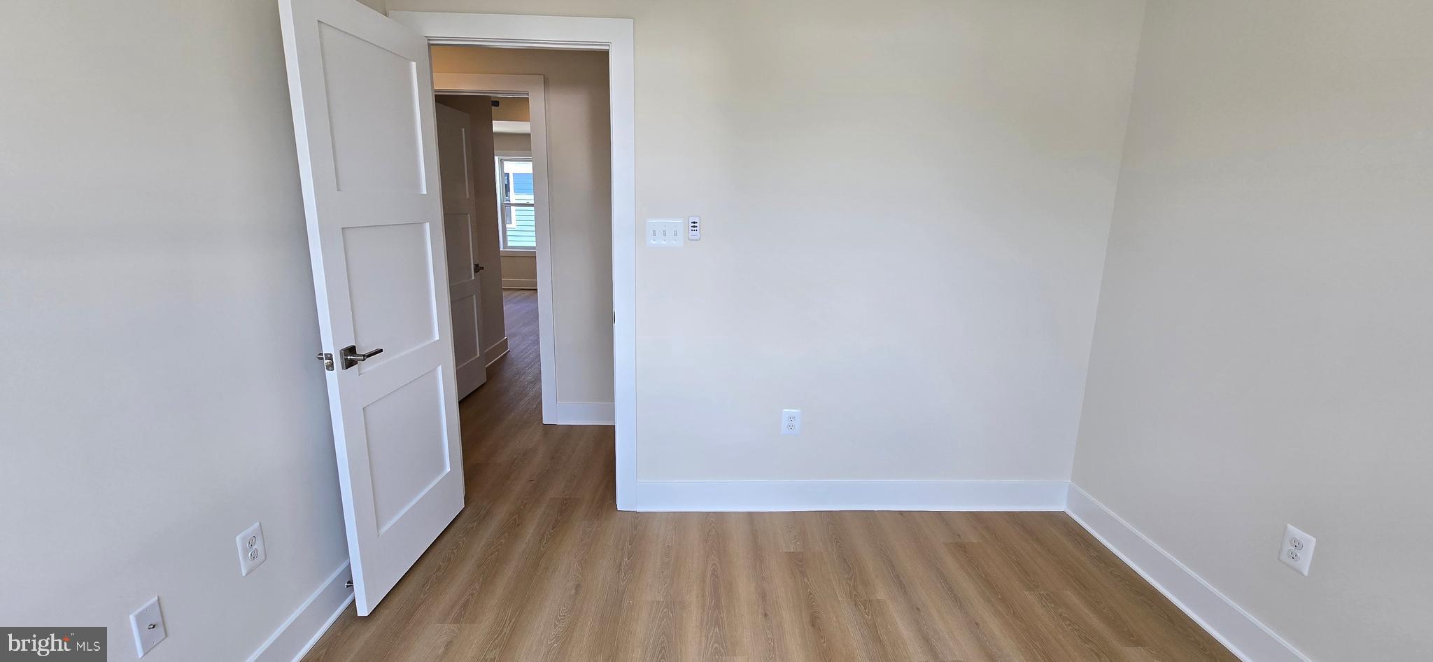 424 Chapel Alley, Unit 7 Frederick, MD 21701 - Photo 20 of 41 a view of a hallway with wooden floor