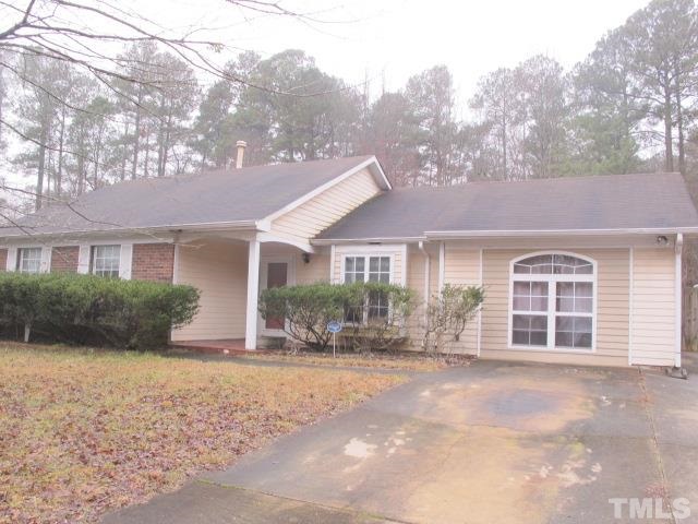 1006 Buckhorn Road Garner, NC 27529 - Photo 2 of 9 a front view of a house with a yard