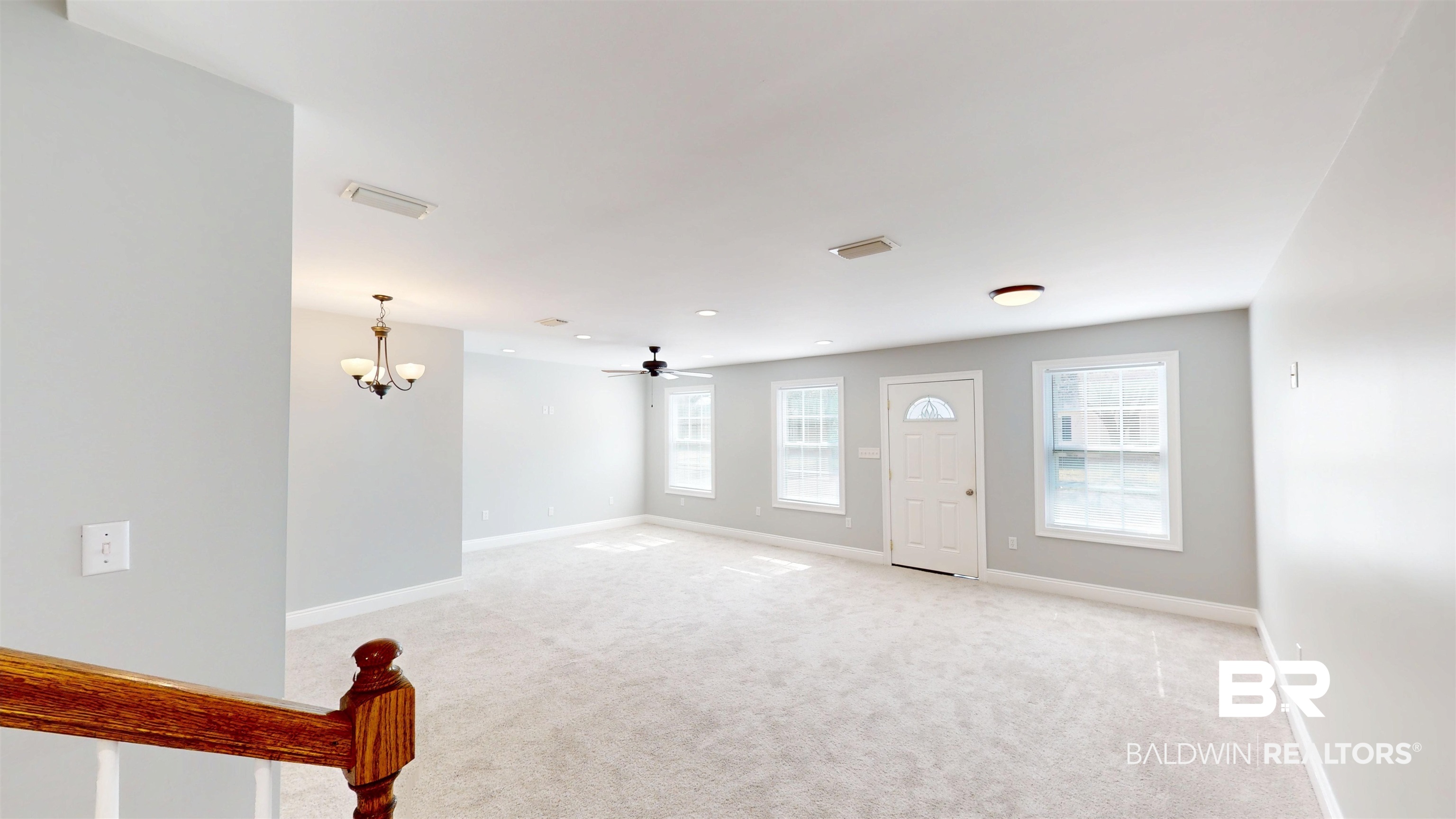 2454 Taylor Avenue Mobile, AL 36606 - Photo 7 of 24 Foyer entrance with light carpet, hanging lights, and ceiling fan