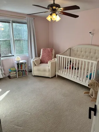 a bedroom with furniture and a window