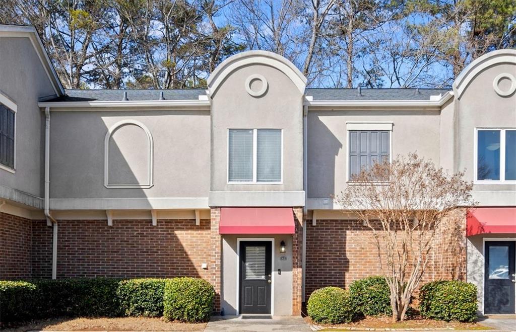 3301 Henderson Mill Road, Unit A2 Atlanta, GA 30341 - Photo 1 of 1 a front view of a house with garden