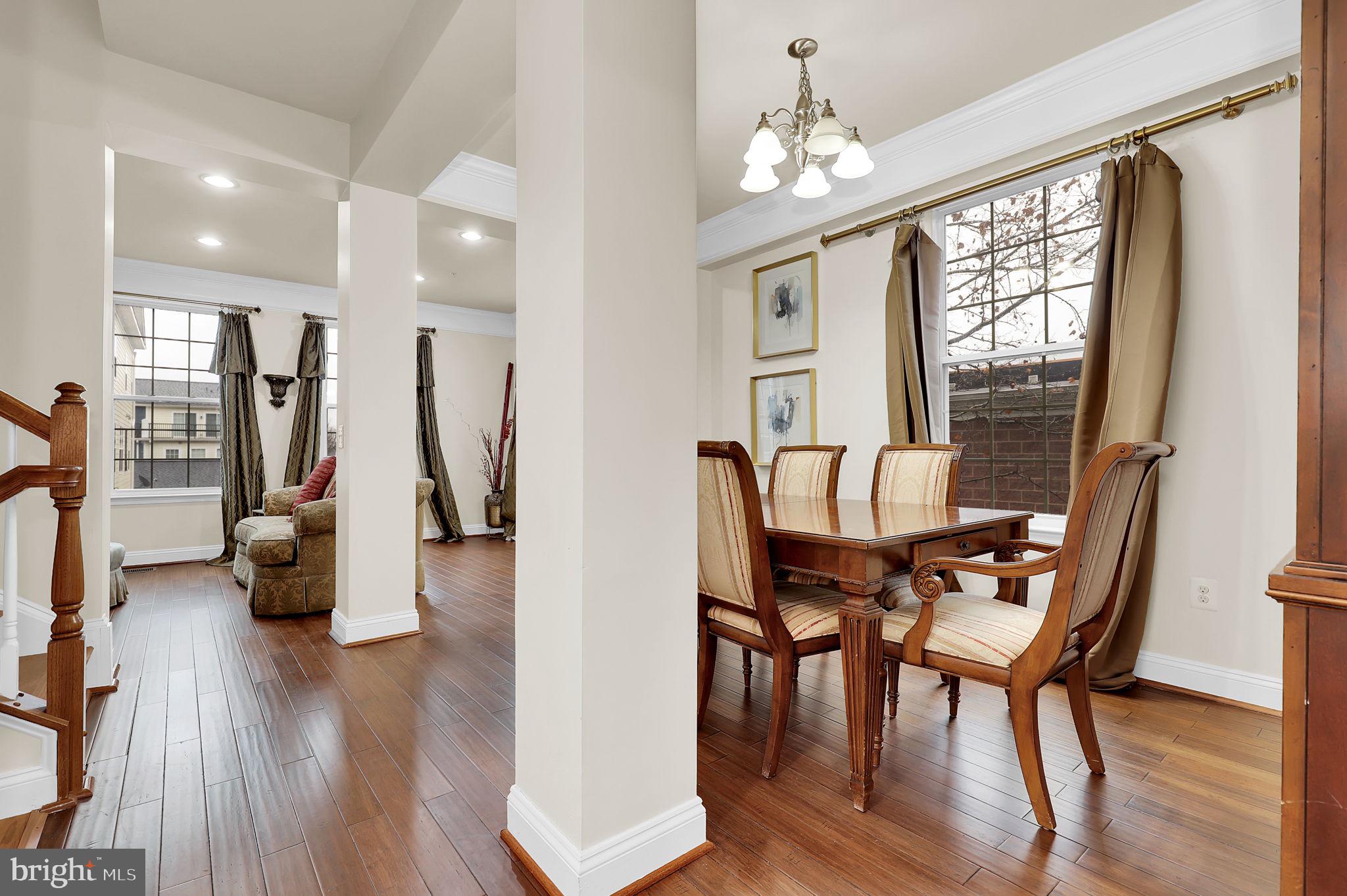 5846 Donovan Lane Ellicott City, MD 21043 - Photo 11 of 31 a view of a dining room with furniture window and wooden floor