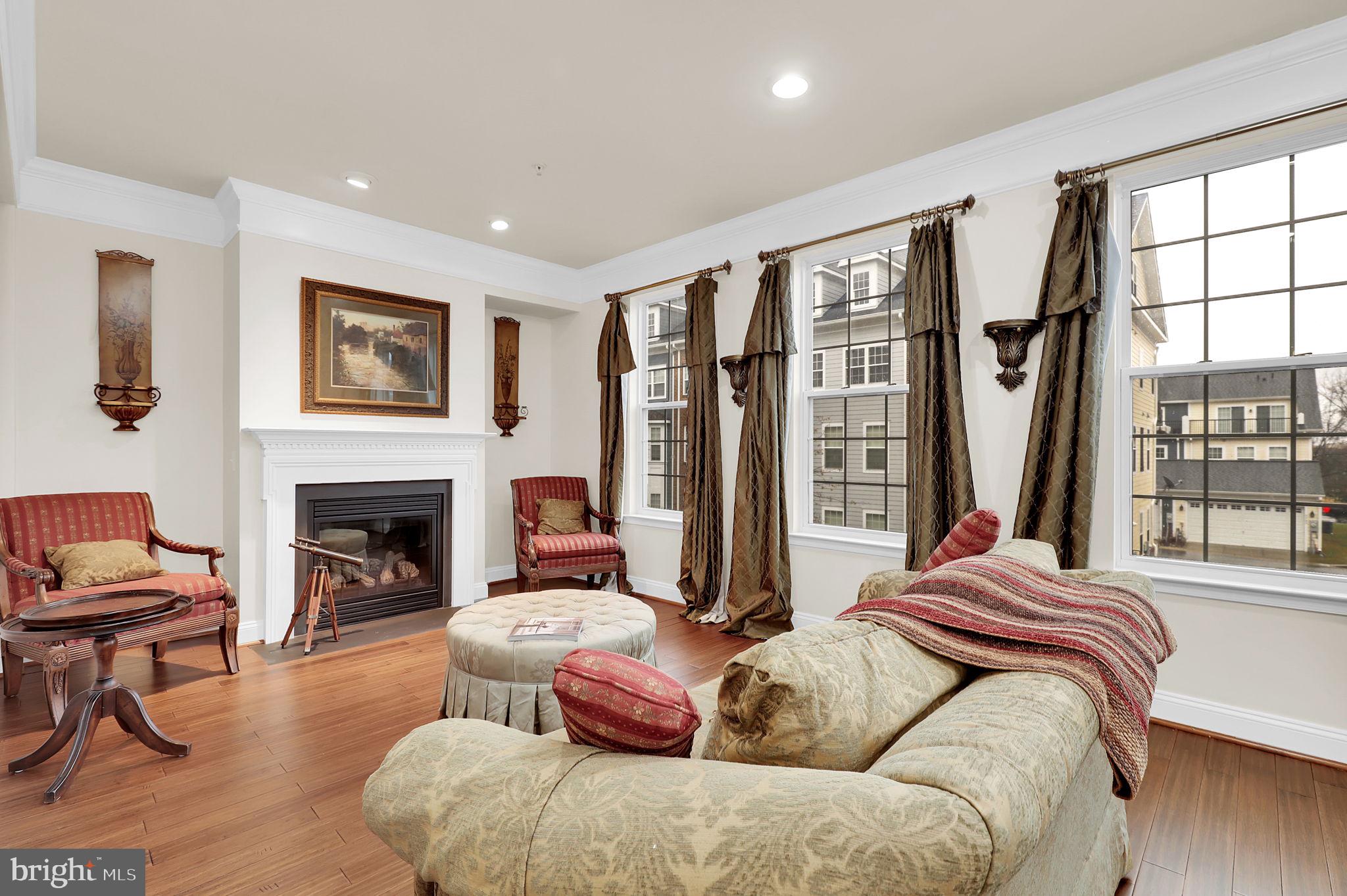5846 Donovan Lane Ellicott City, MD 21043 - Photo 14 of 31 a bed room with furniture and a fireplace