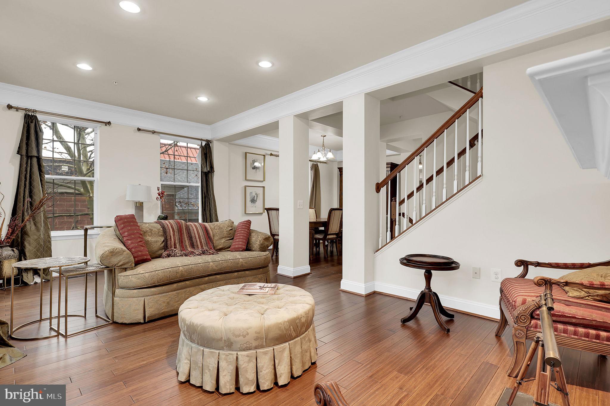 5846 Donovan Lane Ellicott City, MD 21043 - Photo 16 of 31 a living room with furniture and a wooden floor