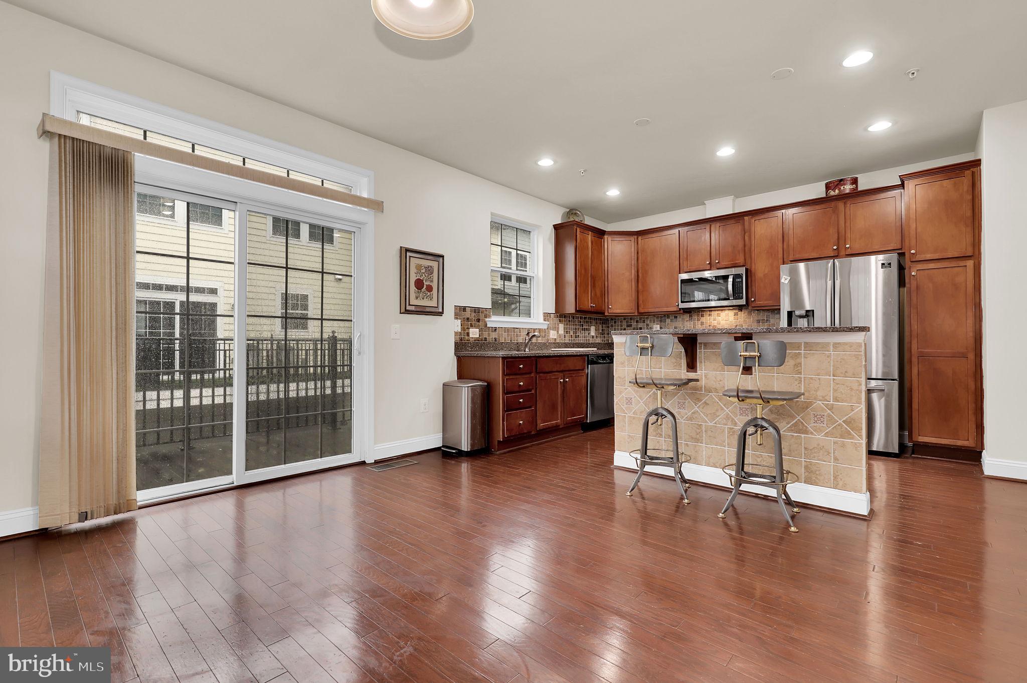5846 Donovan Lane Ellicott City, MD 21043 - Photo 2 of 31 a view of kitchen with stainless steel appliances refrigerator oven and cabinets