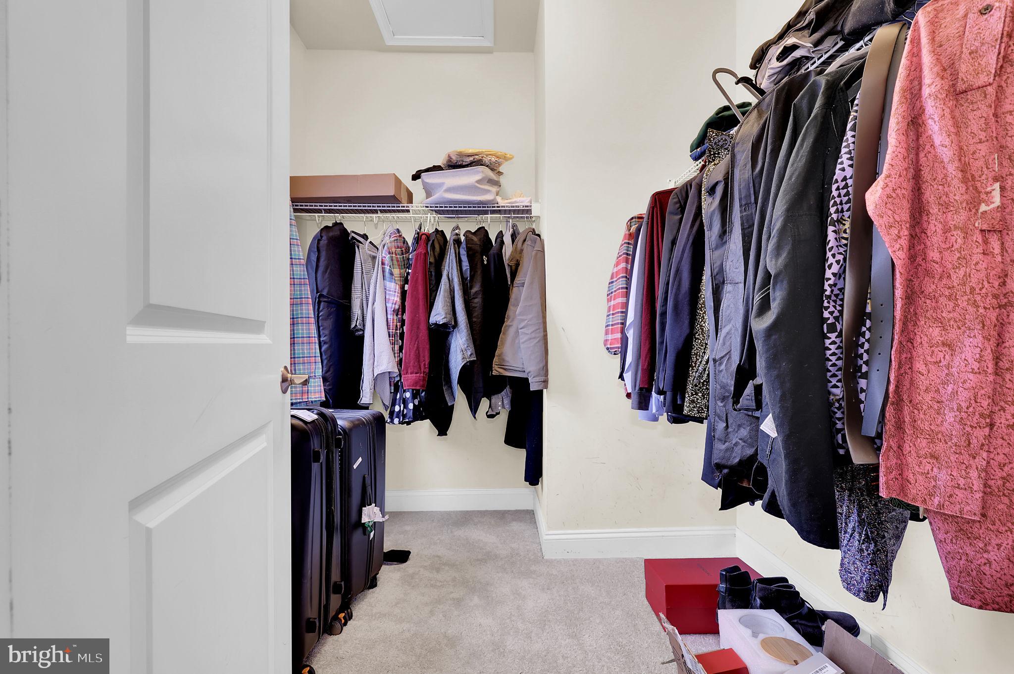 5846 Donovan Lane Ellicott City, MD 21043 - Photo 21 of 31 a view of walk in closet with clothes and shoes