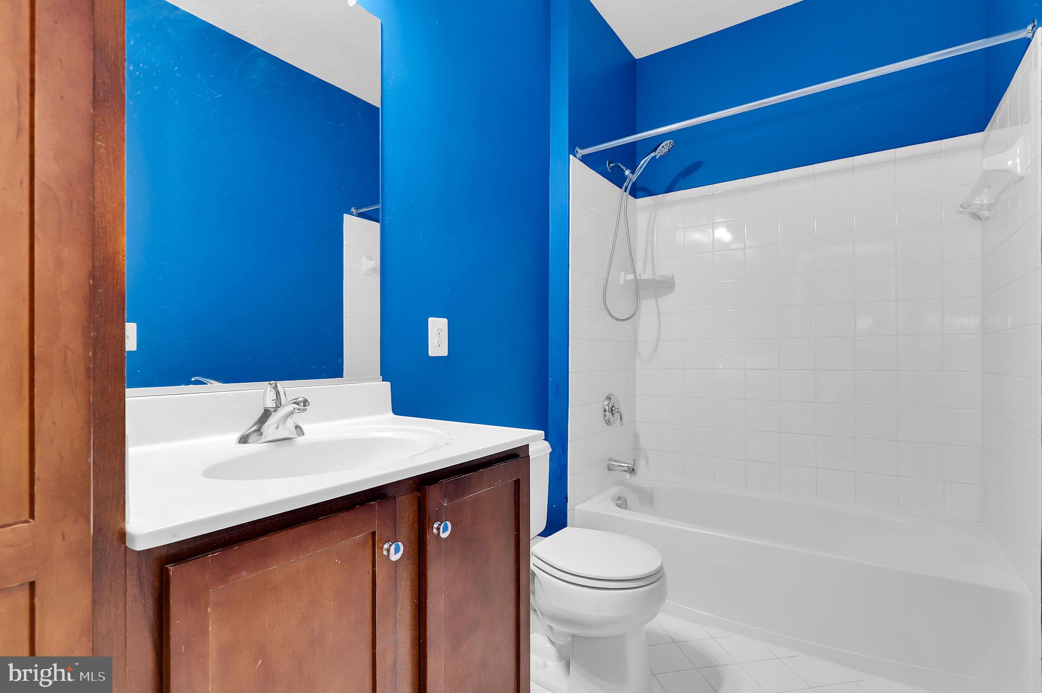 5846 Donovan Lane Ellicott City, MD 21043 - Photo 22 of 31 a bathroom with a sink a toilet and shower