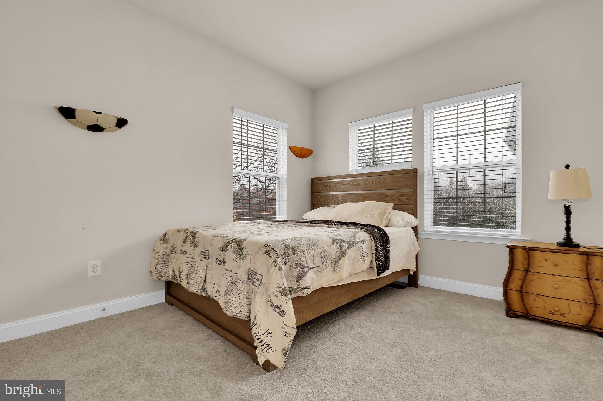 5846 Donovan Lane Ellicott City, MD 21043 - Photo 24 of 31 a bed sitting in a bedroom next to a window