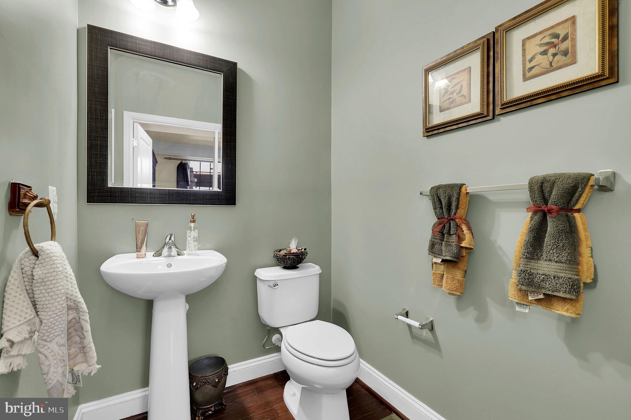 5846 Donovan Lane Ellicott City, MD 21043 - Photo 10 of 31 a bathroom with a toilet sink and mirror