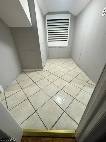 an empty room with wooden floor