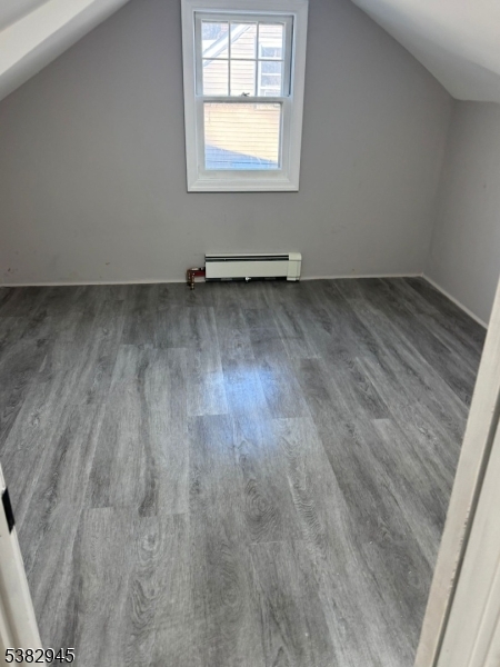 1292 Crescent Avenue Roselle, NJ 07203 - Photo 18 of 35 an empty room with wooden floor and windows