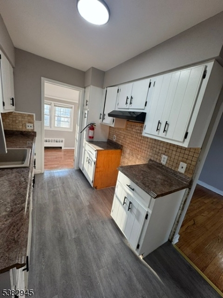 1292 Crescent Avenue Roselle, NJ 07203 - Photo 19 of 35 a kitchen with stainless steel appliances granite countertop a stove and a sink