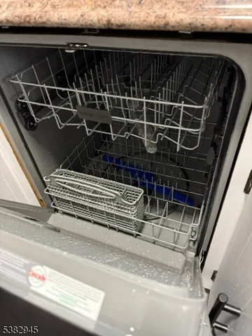 a close view of kitchen island a sink a stove and refrigerator