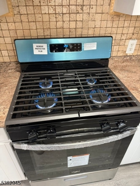 1292 Crescent Avenue Roselle, NJ 07203 - Photo 25 of 35 a stove top oven sitting inside of a kitchen