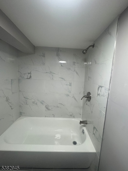 1292 Crescent Avenue Roselle, NJ 07203 - Photo 30 of 35 a bathroom with a bathtub