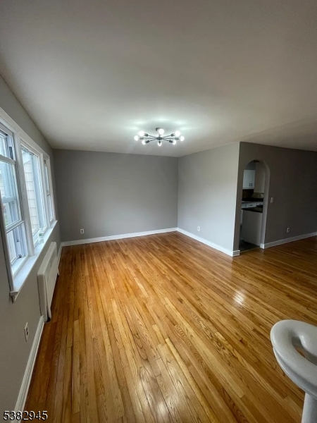 1292 Crescent Avenue Roselle, NJ 07203 - Photo 7 of 35 a view of empty room with wooden floor