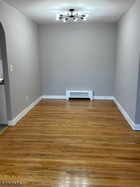 1292 Crescent Avenue Roselle, NJ 07203 - Photo 8 of 35 a view of empty room with wooden floor