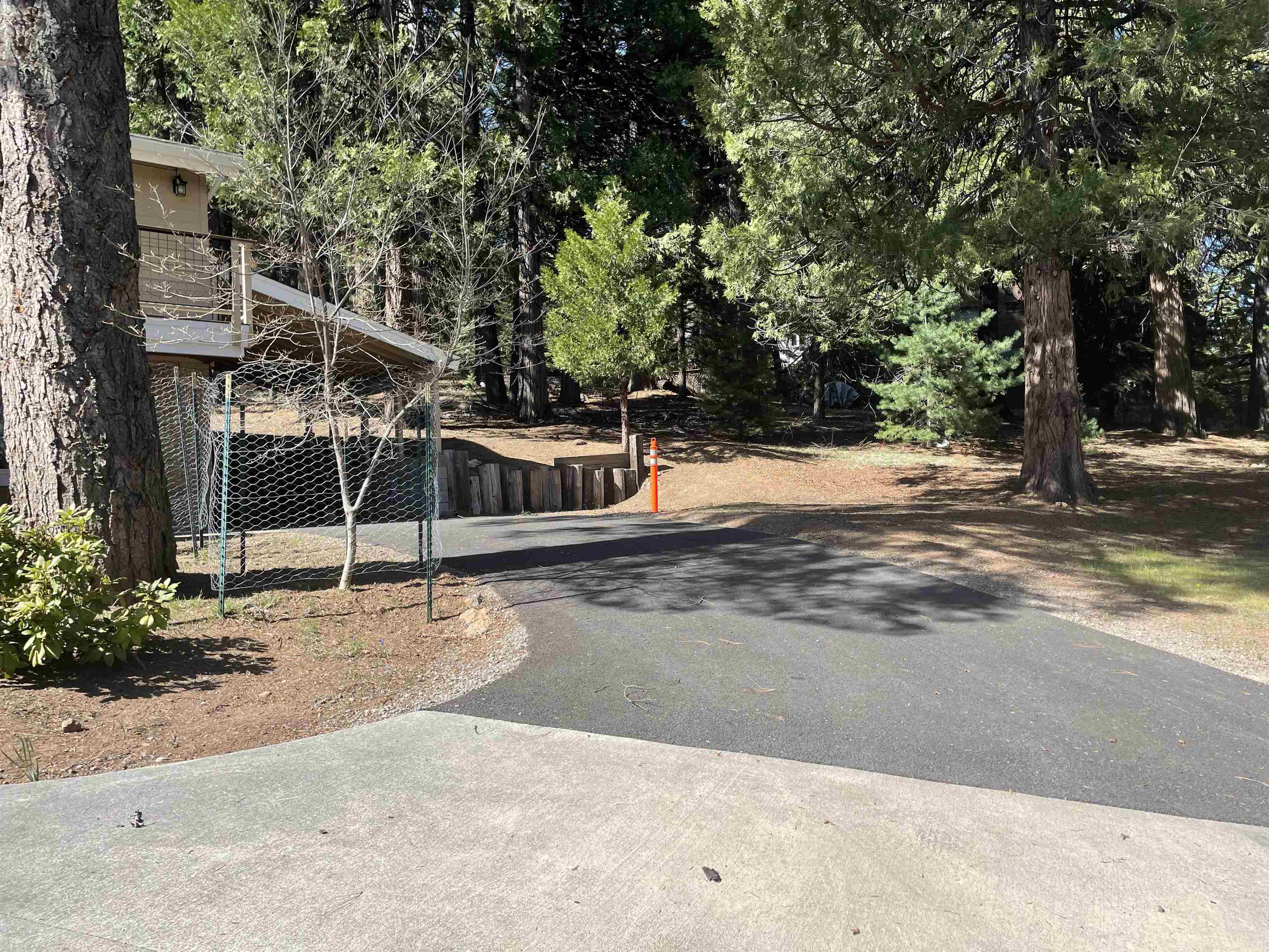 831 Timber Ridge Road Lake Almanor, CA 96137 - Photo 36 of 36 a house with trees in front of it