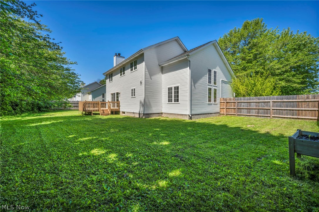 9842 Johnnycake Ridge Road Mentor, OH 44060 - Photo 34 of 40 Expansive green lawn with a wood privacy fence