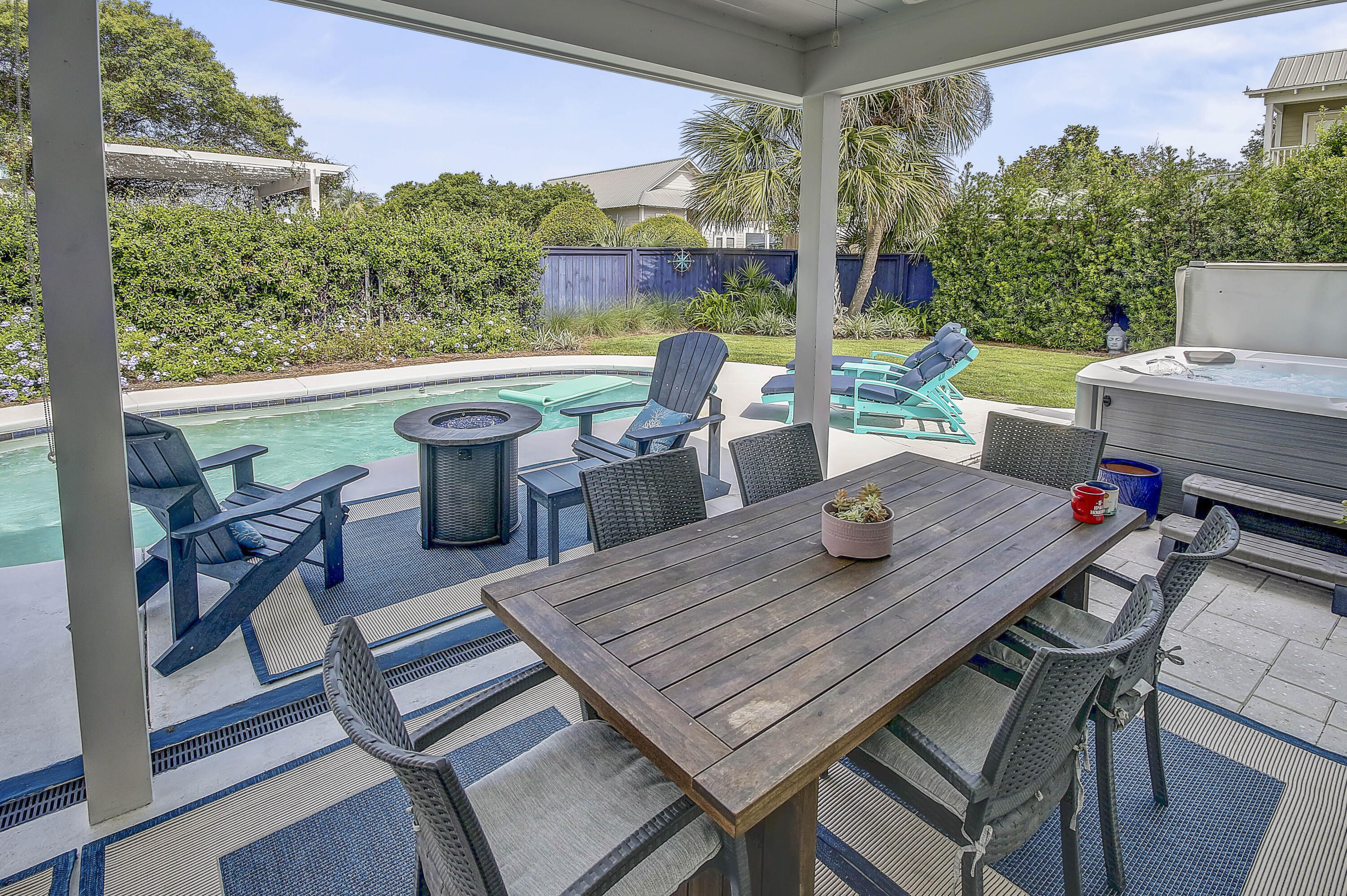 59 Walton Gulfview Drive Inlet Beach, FL 32461 - Photo 16 of 26 a view of a patio with a dining table and chairs